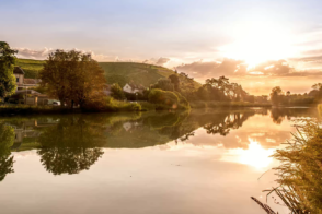 Lakeside scene with sunset reflection