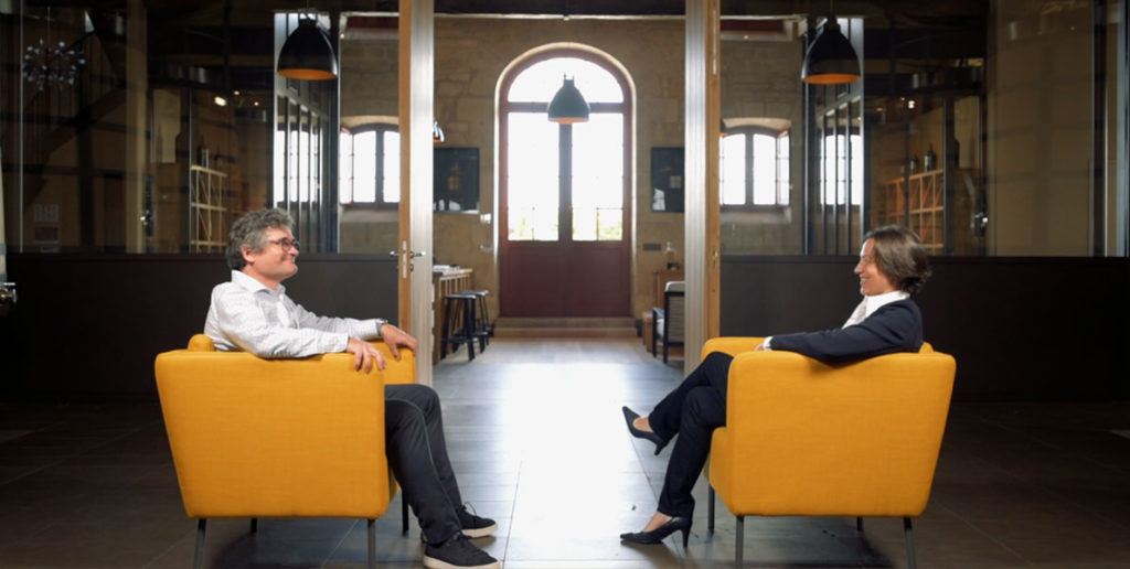twins-conversation-in-a-well-lit-room-negociant-bordeaux
